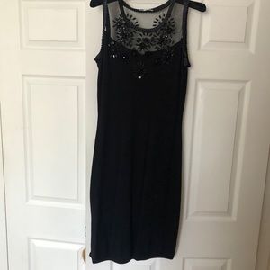 Black knit dress with mesh neck embroidered with stones